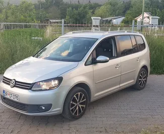 Front view of a rental Volkswagen Touran in Bar, Montenegro ✓ Car #549. ✓ Automatic TM ✓ 22 reviews.