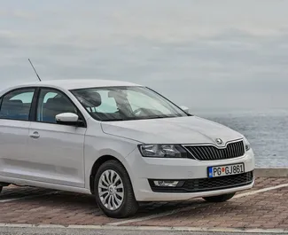 Front view of a rental Skoda Rapid in Budva, Montenegro ✓ Car #1267. ✓ Automatic TM ✓ 6 reviews.