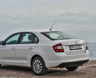 Skoda Rapid 2019 car hire in Montenegro, featuring ✓ Petrol fuel and 110 horsepower ➤ Starting from 27 EUR per day.