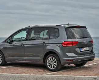 Volkswagen Touran 2016 car hire in Montenegro, featuring ✓ Diesel fuel and 85 horsepower ➤ Starting from 32 EUR per day.