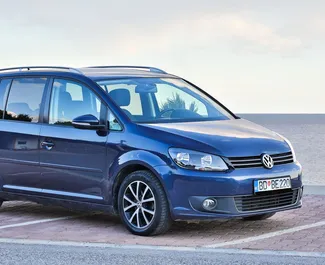 Front view of a rental Volkswagen Touran in Budva, Montenegro ✓ Car #1035. ✓ Automatic TM ✓ 9 reviews.