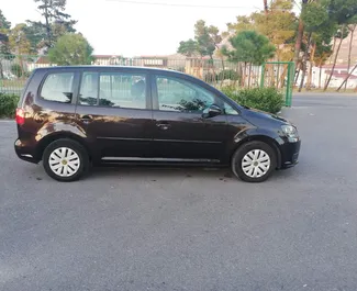Volkswagen Touran 2015 car hire in Montenegro, featuring ✓ Diesel fuel and 110 horsepower ➤ Starting from 25 EUR per day.