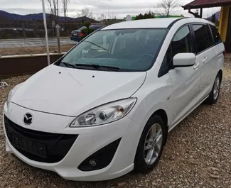 Front view of a rental Mazda 5 at Burgas Airport, Bulgaria ✓ Car #2872. ✓ Automatic TM ✓ 0 reviews.