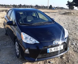 Noleggio auto Toyota Prius C 2014 in Georgia, con carburante Benzina e 99 cavalli di potenza ➤ A partire da 74 GEL al giorno.