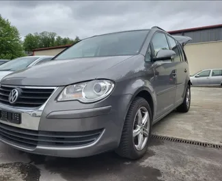 Front view of a rental Volkswagen Touran at Tirana airport, Albania ✓ Car #10084. ✓ Manual TM ✓ 2 reviews.