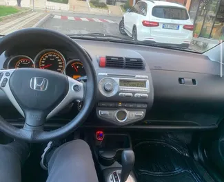 Petrol 1.4L engine of Honda Jazz 2008 for rental at Tirana airport.
