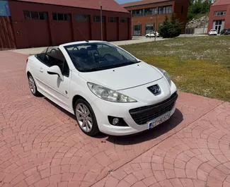 Front view of a rental Peugeot 207cc in Budva, Montenegro ✓ Car #13419. ✓ Manual TM ✓ 18 reviews.
