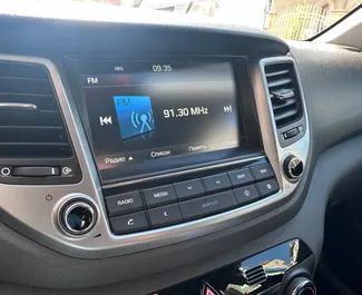 Interior of Hyundai Tucson for hire in Bulgaria. A Great 5-seater car with a Automatic transmission.