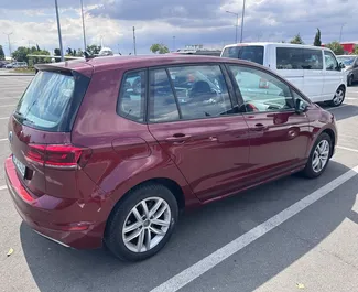 Interior of Volkswagen Golf Sportsvan for hire in Bulgaria. A Great 5-seater car with a Automatic transmission.