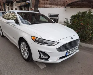 Přední pohled na pronájem Ford Fusion Sedan v Tbilisi, Georgia ✓ Auto č. 15307. ✓ Převodovka Automatické TM ✓ Recenze 0.
