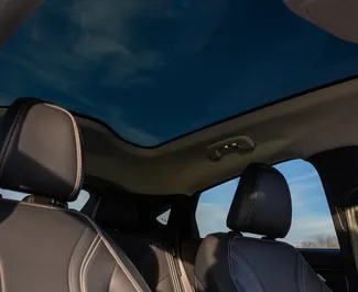 Ford Mustang Mach E noma. Premium, Luksusa, SUV automašīna nomai Gruzijā ✓ Depozīts 560 GEL ✓ Apdrošināšanas iespējas: TPL, CDW, SCDW, FDW, Pasažieri, Krāpšana.